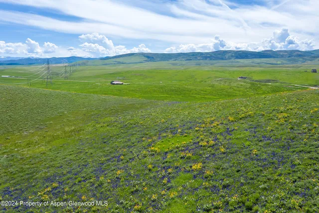 a view of an ocean and a yard