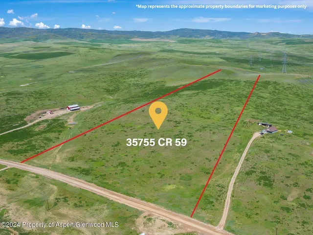 a view of a golf course with a lake