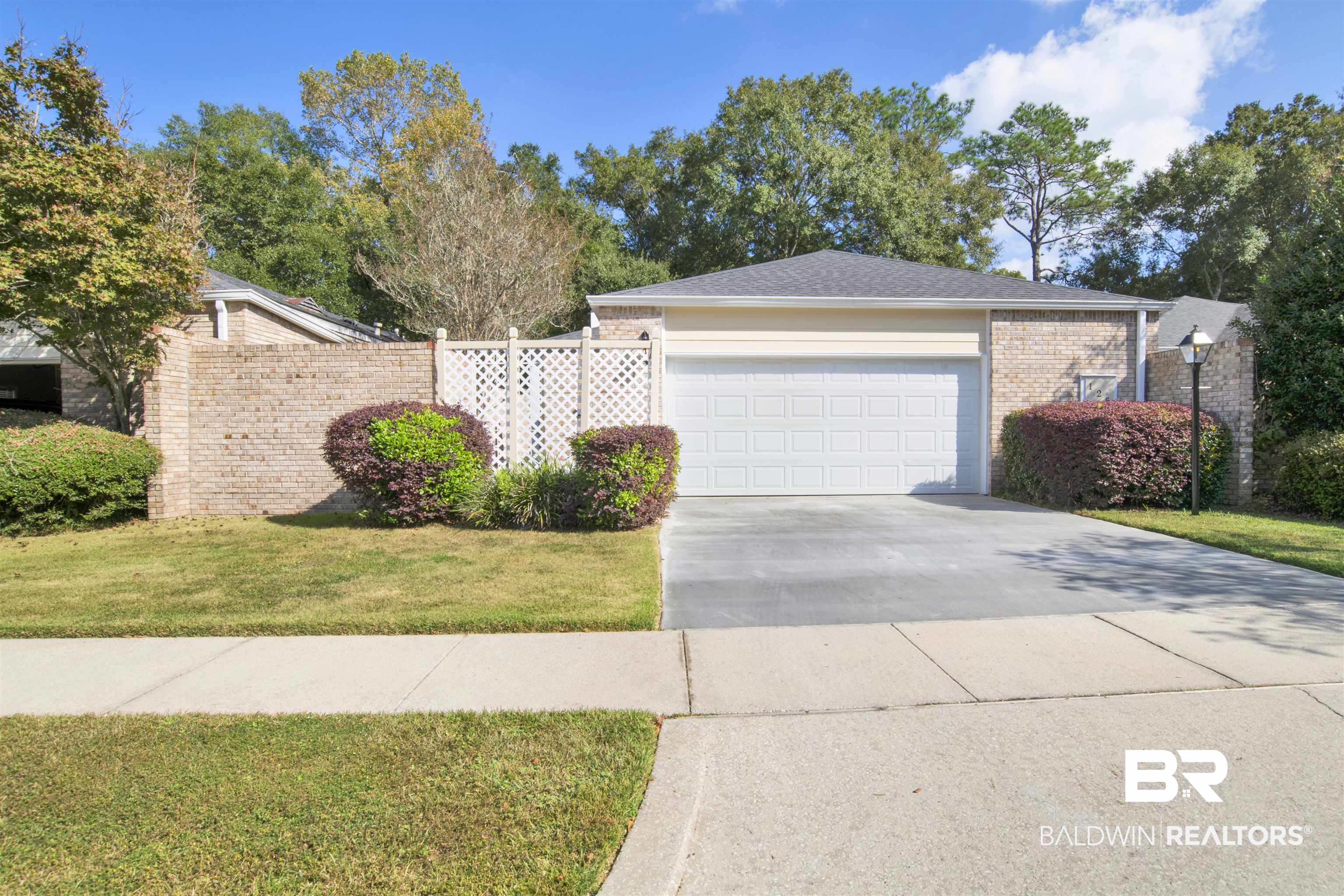 125 Woodruff Court Mobile, AL 36608 - Photo 27 of 27 Ranch-style home with a front yard and a garage