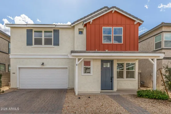 a front view of a house with a garage