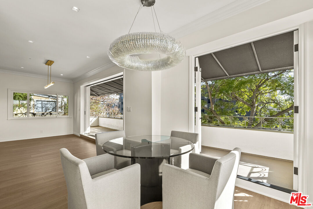1326 Londonderry View Drive, Unit 4 Los Angeles, CA 90069 - Photo 7 of 29 a living room with furniture and a large window