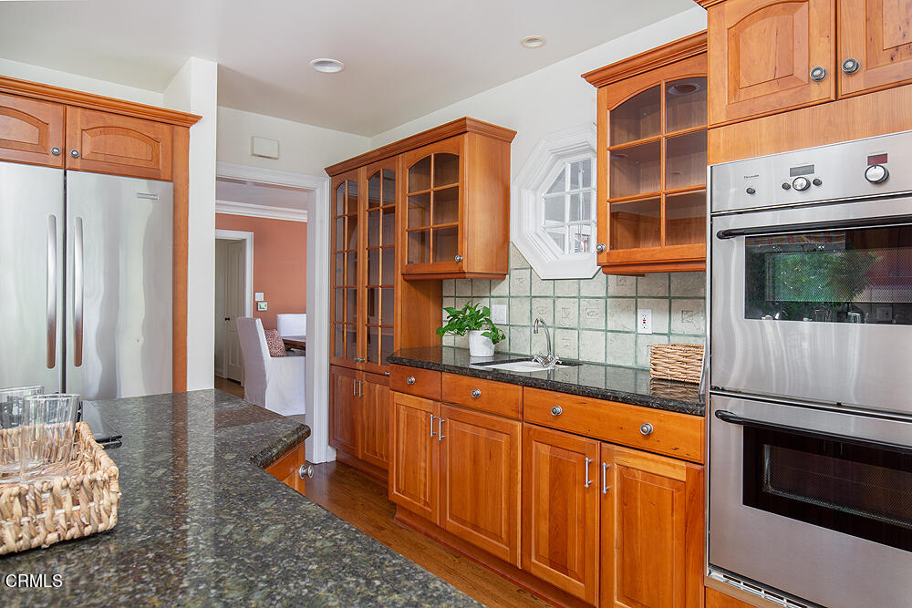 141 Sierra View Road Pasadena, CA 91105 - Photo 15 of 38 a kitchen with stainless steel appliances granite countertop a stove a sink and a microwave