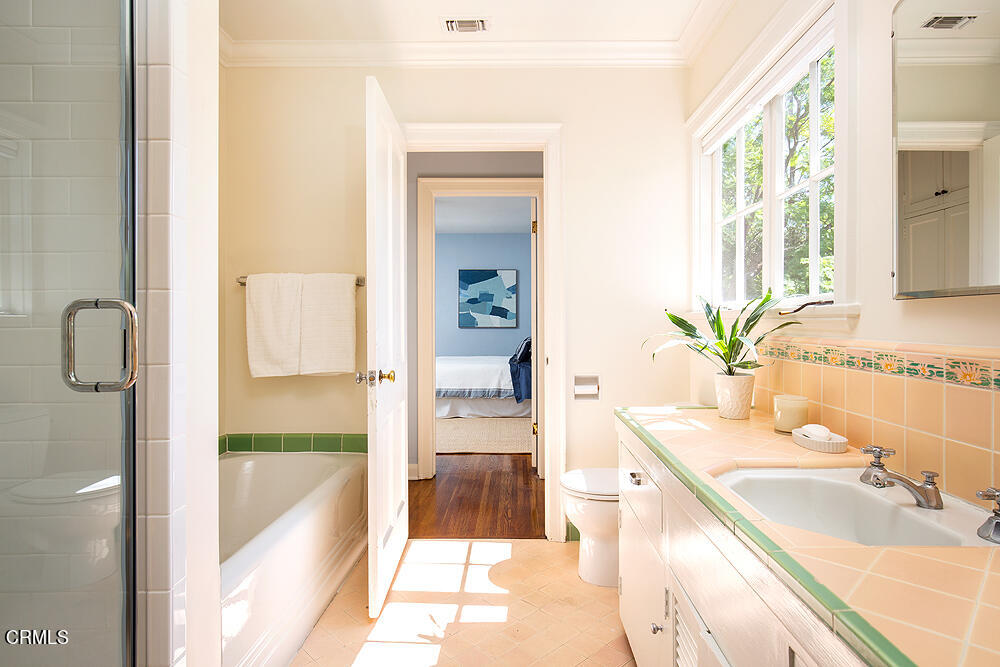 141 Sierra View Road Pasadena, CA 91105 - Photo 24 of 38 a spacious bathroom with a granite countertop sink and a mirror