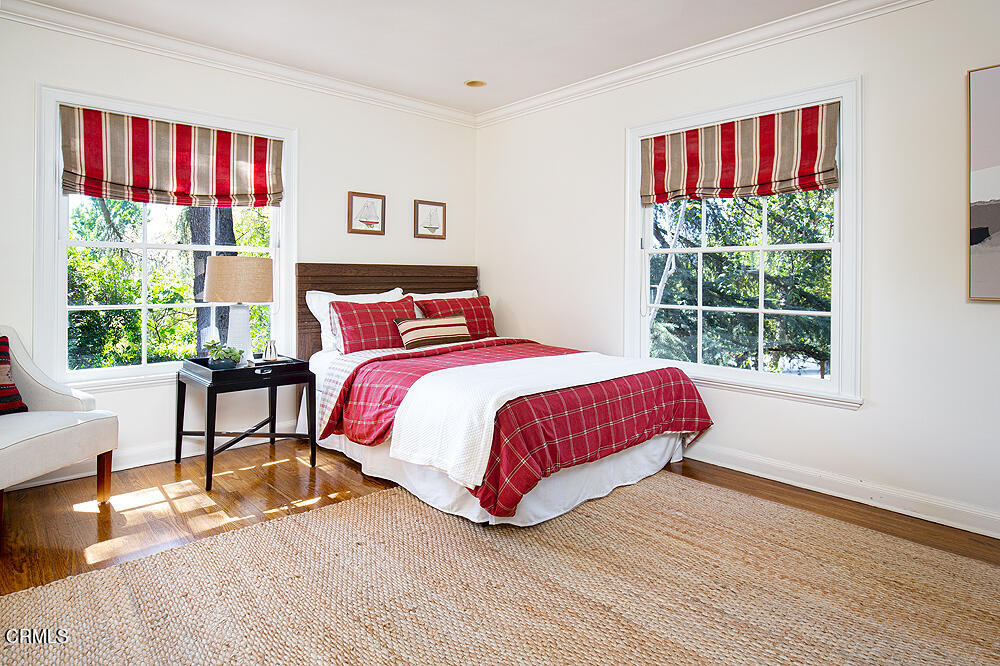 141 Sierra View Road Pasadena, CA 91105 - Photo 26 of 38 a bedroom with a bed and a large window