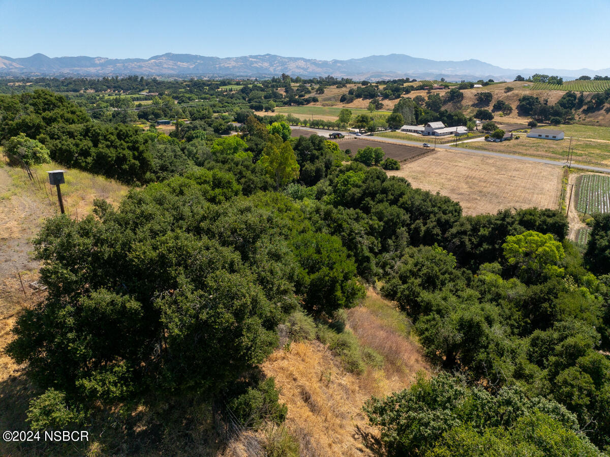 Alamo Pintado Road Solvang, CA 93463 - Photo 21 of 24 a view of a city with mountains in the background
