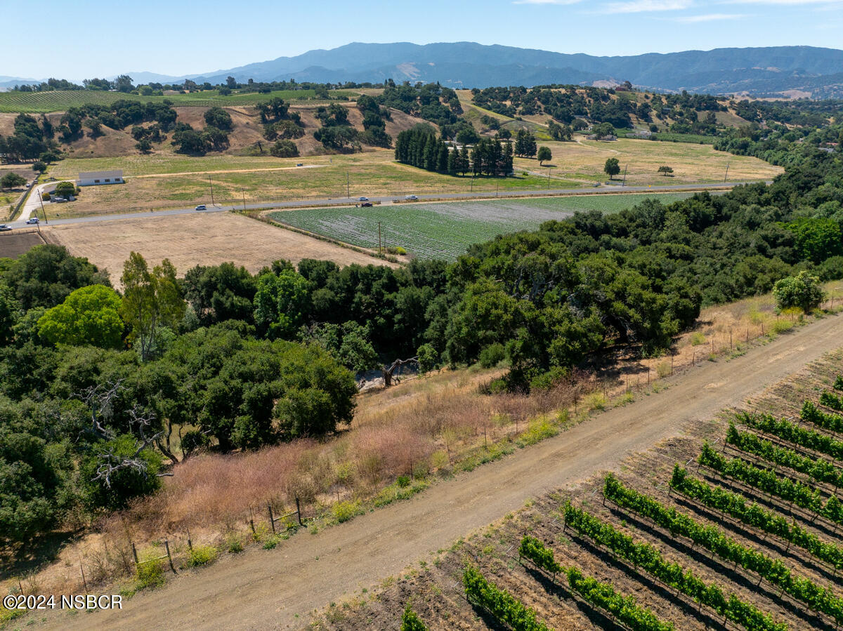Alamo Pintado Road Solvang, CA 93463 - Photo 22 of 24 a view of a road with an outdoor space and seating