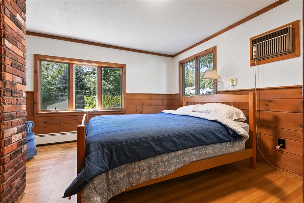 60 Park Road Charlton, MA 01507 - Photo 13 of 30 a bedroom with a large bed and a large window