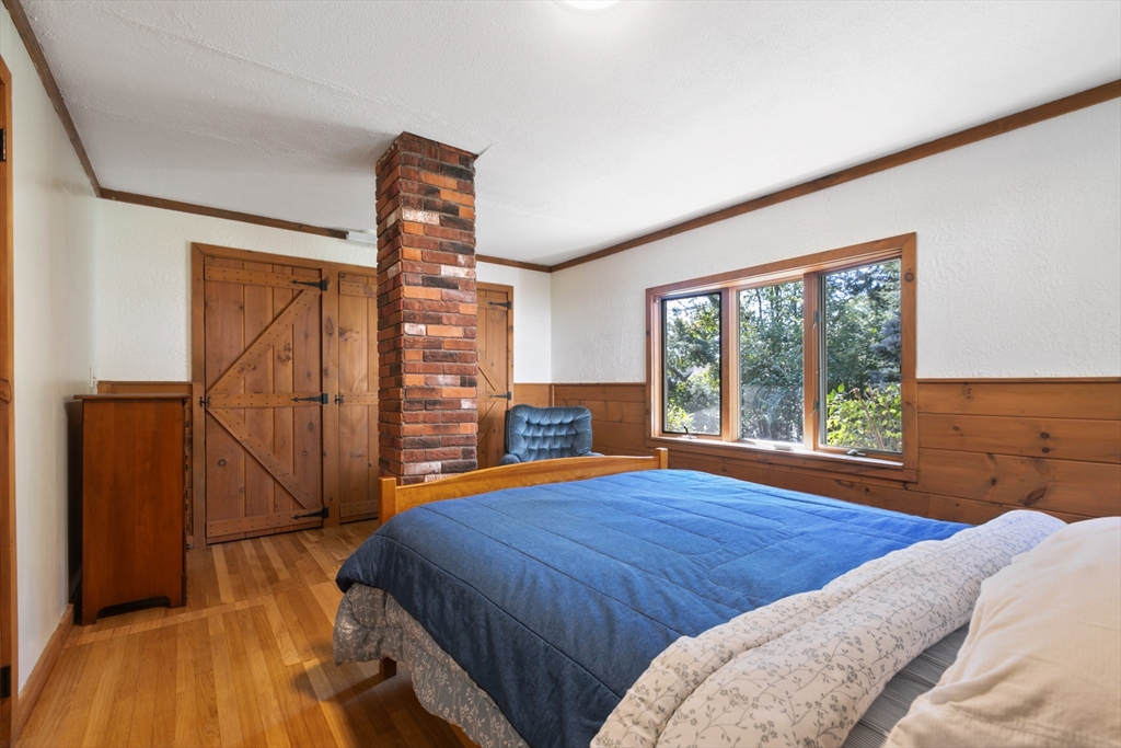 60 Park Road Charlton, MA 01507 - Photo 14 of 30 a bedroom with a bed and a large window with outer view