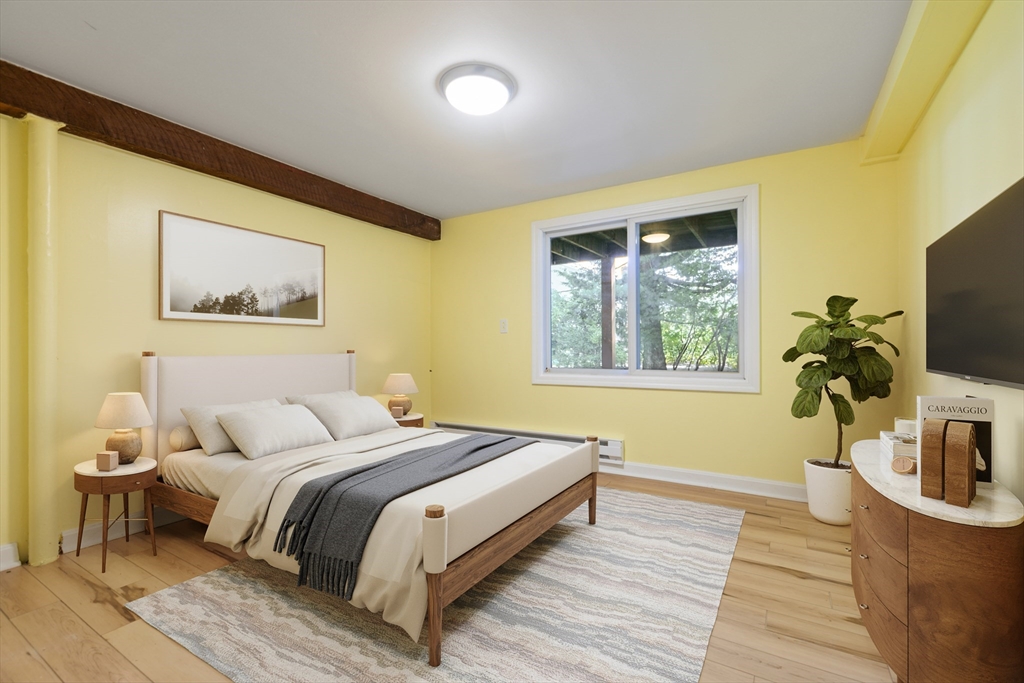 60 Park Road Charlton, MA 01507 - Photo 18 of 30 a bedroom with a bed and a flat screen tv
