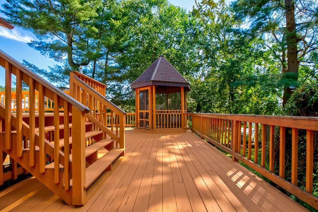 60 Park Road Charlton, MA 01507 - Photo 19 of 30 a balcony with wooden floor and trees in the back
