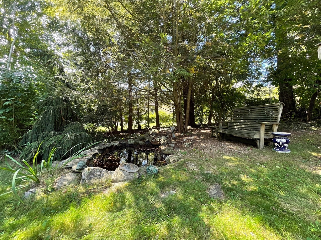 60 Park Road Charlton, MA 01507 - Photo 23 of 30 a view of a bench in a backyard