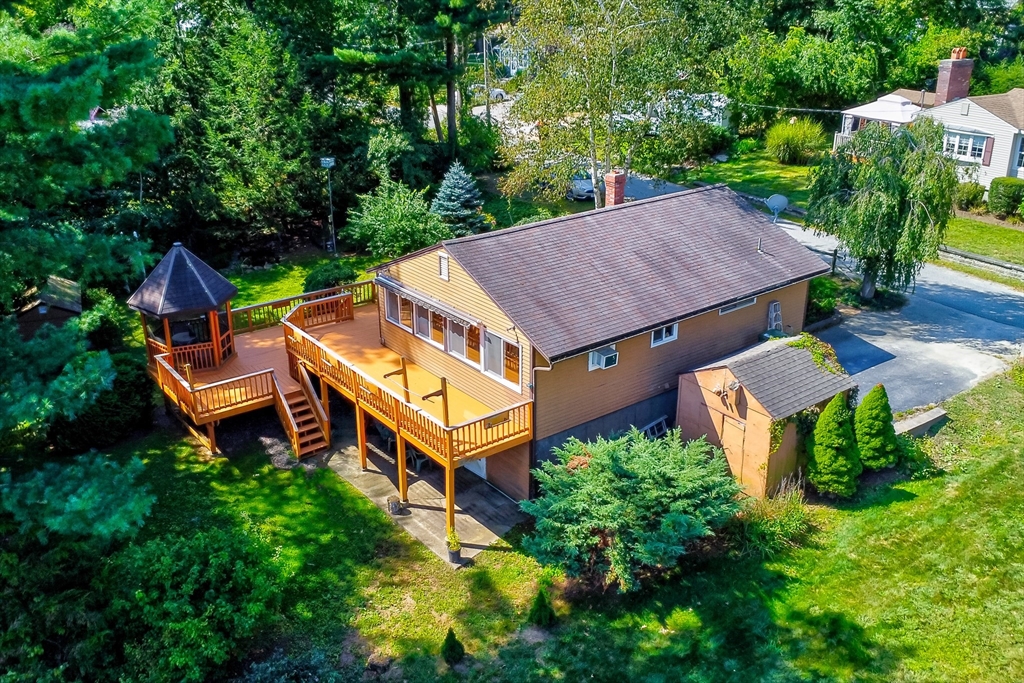 60 Park Road Charlton, MA 01507 - Photo 5 of 30 an aerial view of a house with balcony and trees al around