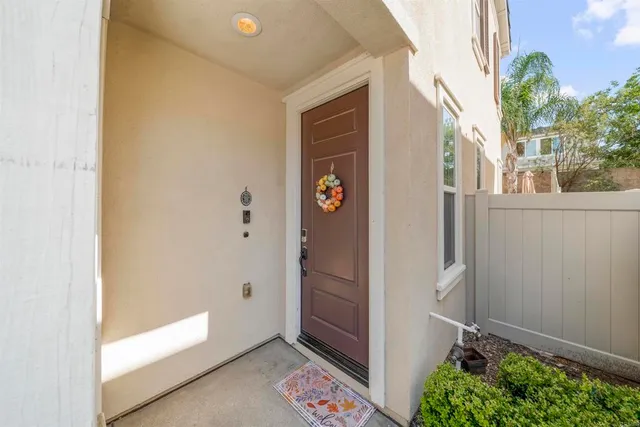 a view of an entryway with wooden floor
