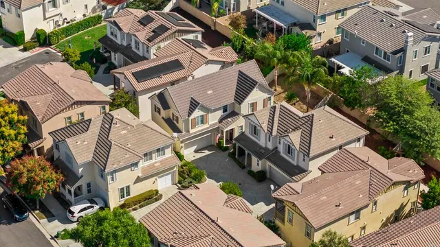an aerial view of a house with a yard