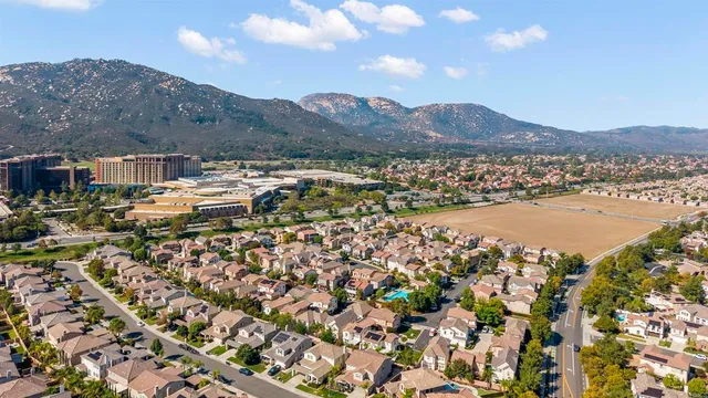 an aerial view of residential houses and outdoor space