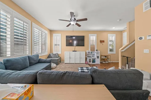 a living room with furniture and a large window
