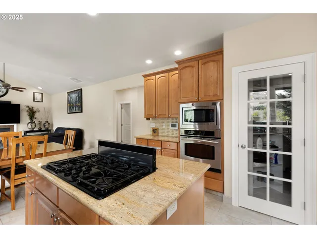 a dining room with furniture window and wooden floor