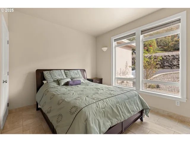 a bedroom with a bed and walk in closet