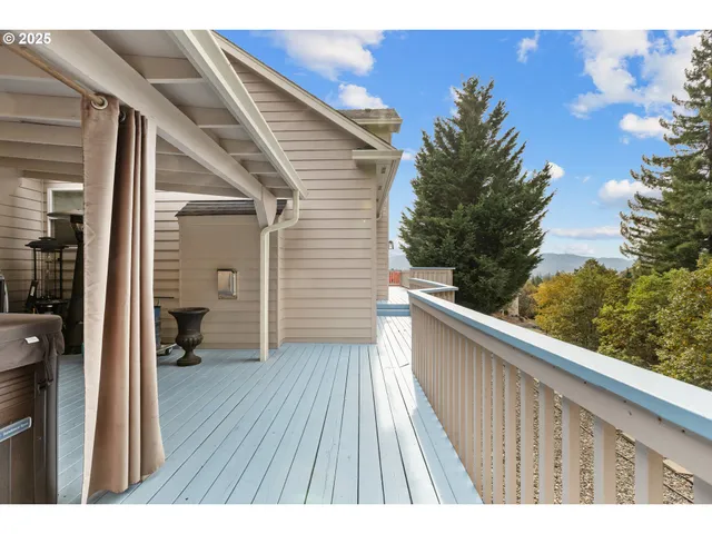a view of a patio with a table and chairs
