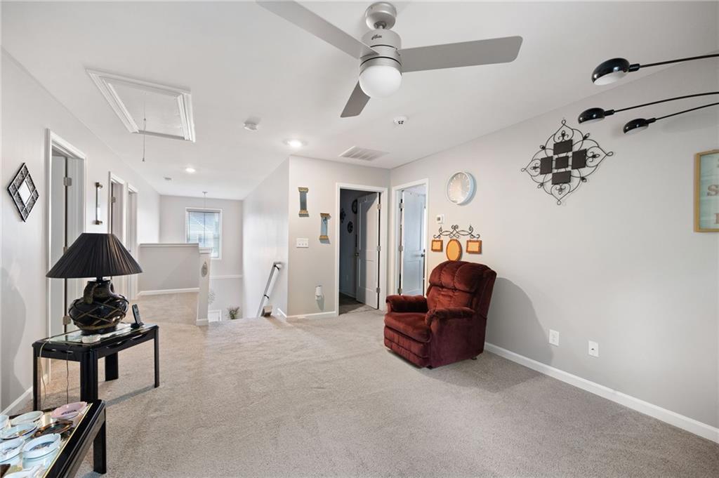406 Splash Pointe Temple, GA 30179 - Photo 20 of 33 a living room with furniture and a chandelier