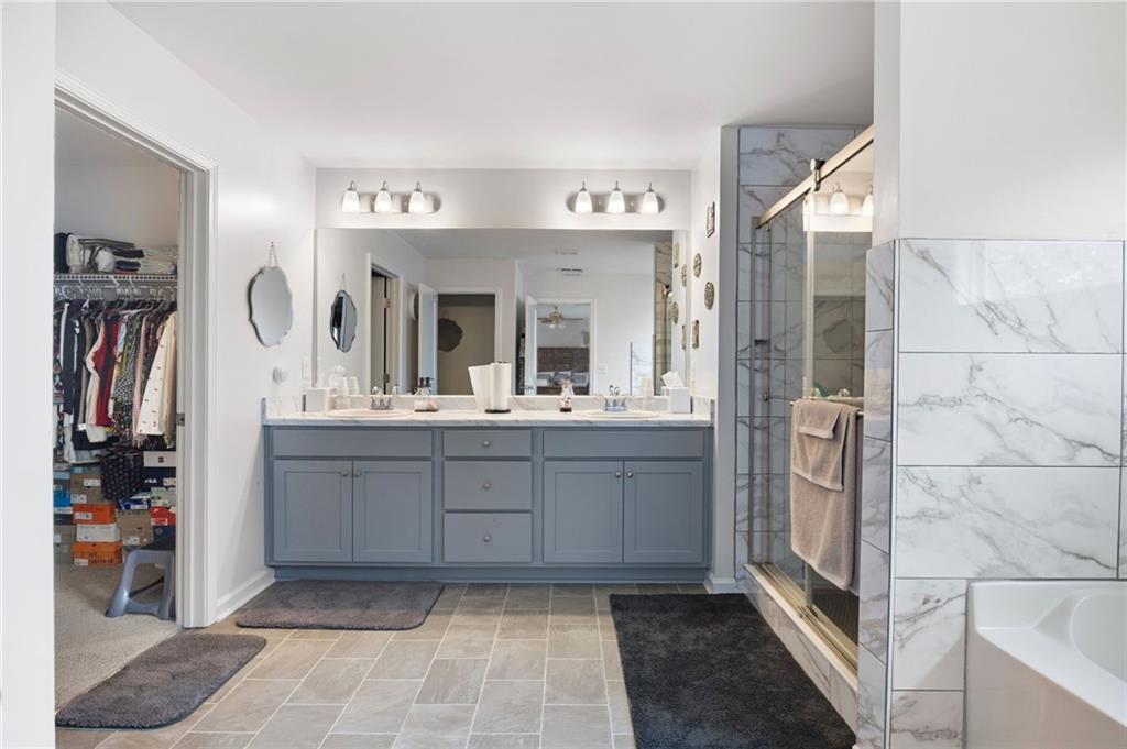 406 Splash Pointe Temple, GA 30179 - Photo 23 of 33 a bathroom with a sink a mirror and a shower
