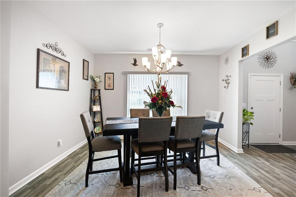 406 Splash Pointe Temple, GA 30179 - Photo 4 of 33 a view of a dining room with furniture and chandelier