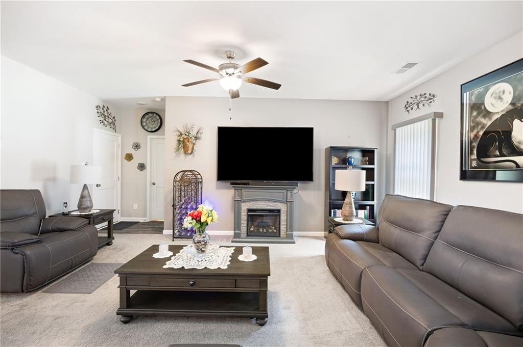 406 Splash Pointe Temple, GA 30179 - Photo 6 of 33 a living room with fireplace furniture and a flat screen tv