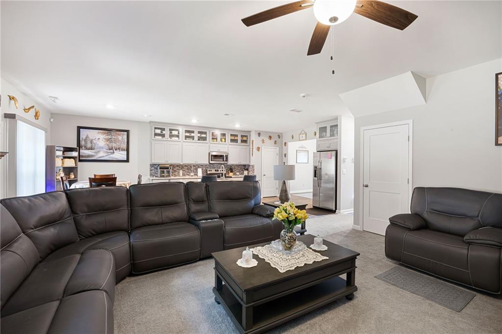 406 Splash Pointe Temple, GA 30179 - Photo 9 of 33 a living room with furniture couches and kitchen view