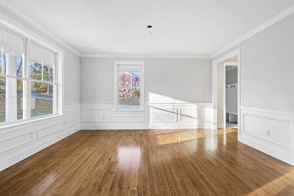 430 High Street Walpole, MA 02081 - Photo 13 of 42 a view of empty room with wooden floor and fan