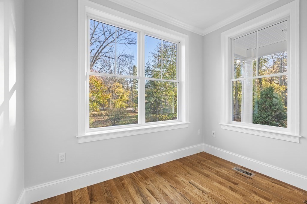 430 High Street Walpole, MA 02081 - Photo 15 of 42 a view of an empty room with wooden floor and a window