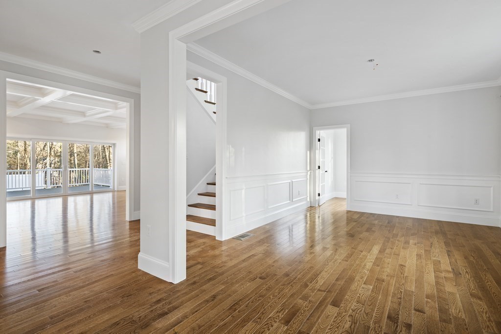 430 High Street Walpole, MA 02081 - Photo 16 of 42 a view of empty room with wooden floor and floor to ceiling window