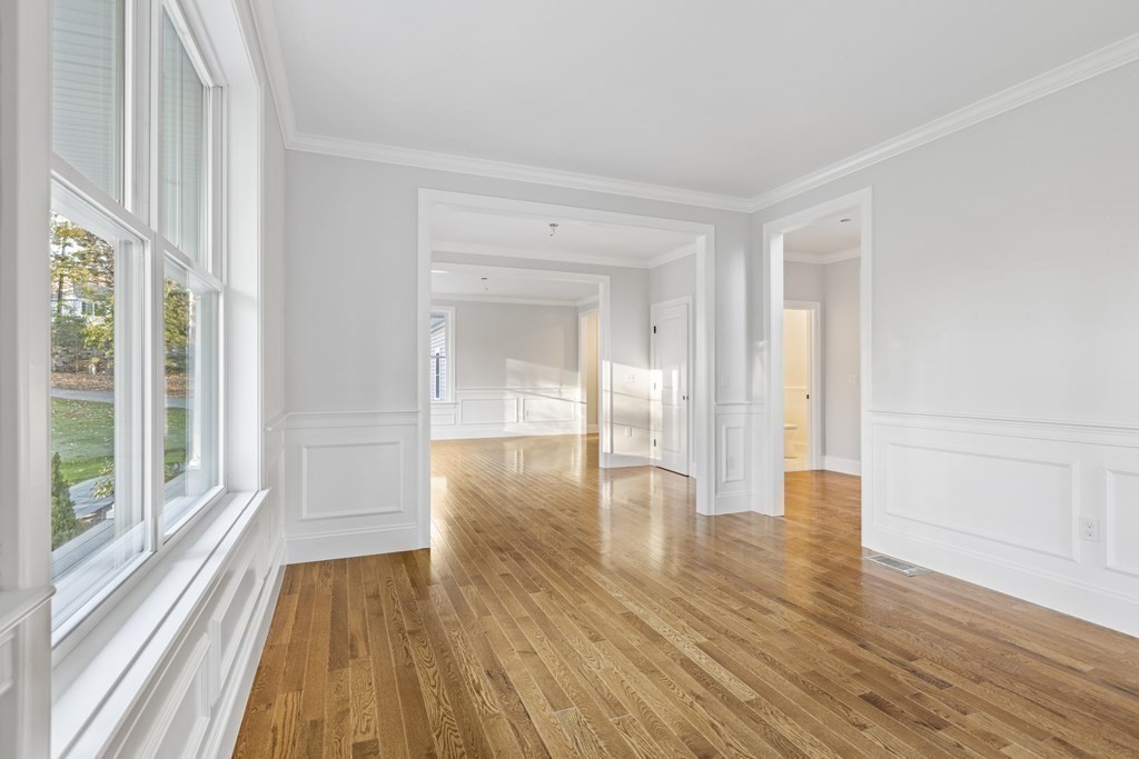 430 High Street Walpole, MA 02081 - Photo 17 of 42 a view of empty room with wooden floor and fan