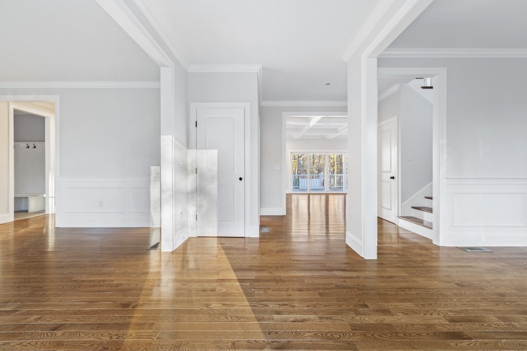 430 High Street Walpole, MA 02081 - Photo 18 of 42 a view of an empty room with wooden floor and a bathroom