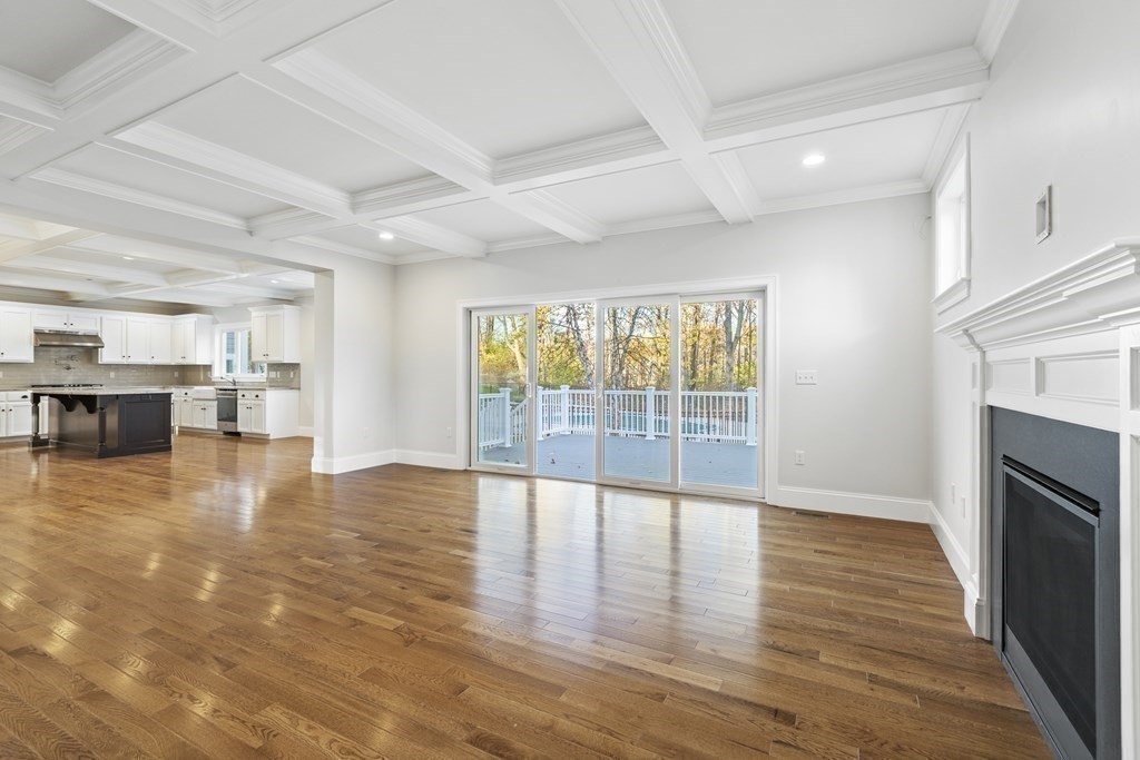 430 High Street Walpole, MA 02081 - Photo 19 of 42 a view of an empty room with kitchen and a window