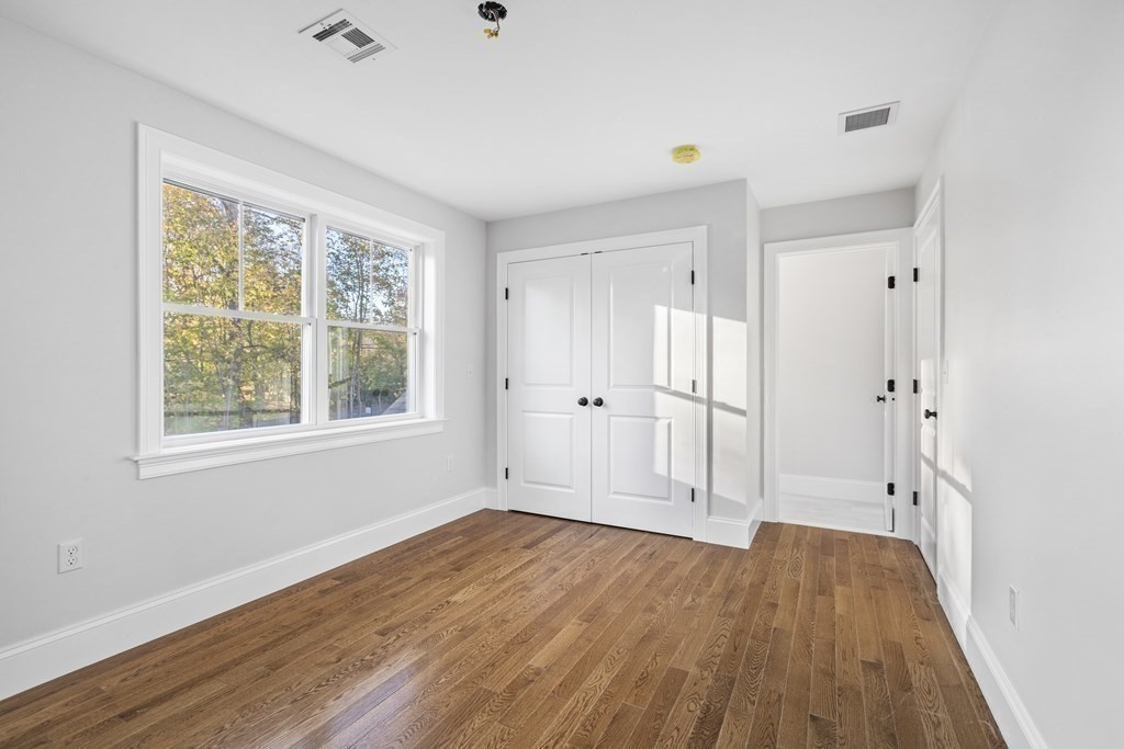 430 High Street Walpole, MA 02081 - Photo 20 of 42 a view of empty room with wooden floor and fan