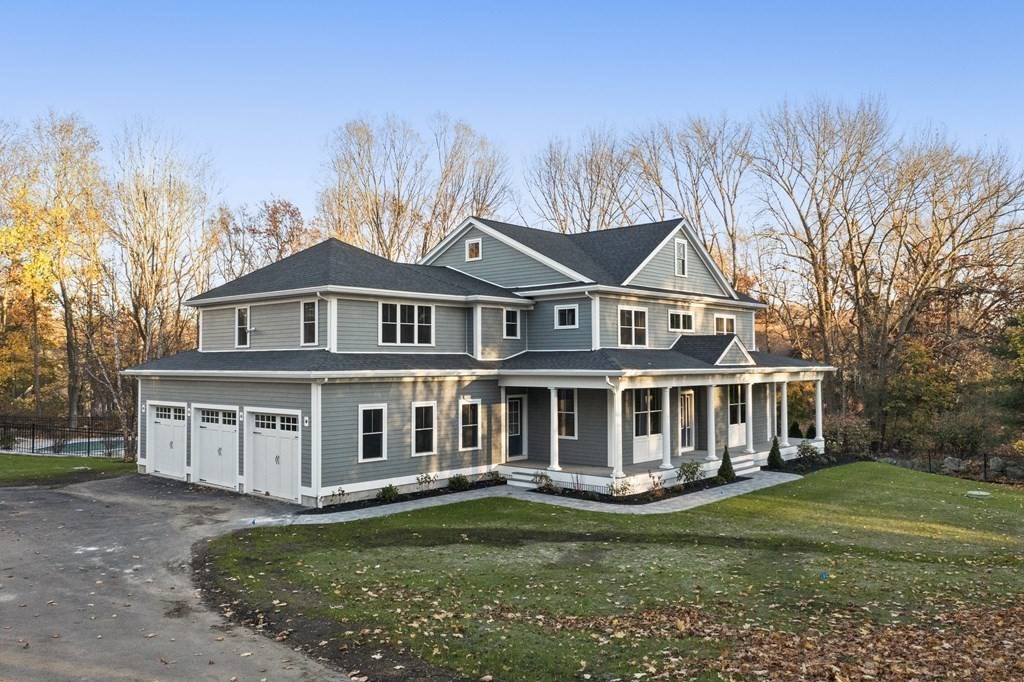 430 High Street Walpole, MA 02081 - Photo 2 of 42 a view of a house with a garden and trees