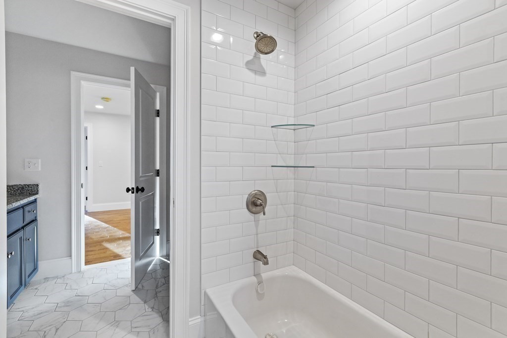 430 High Street Walpole, MA 02081 - Photo 23 of 42 a bathroom with a tub and shower
