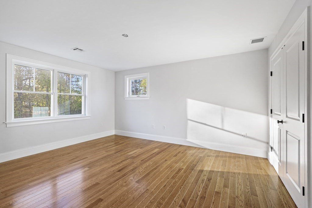 430 High Street Walpole, MA 02081 - Photo 25 of 42 a view of empty room with wooden floor and fan