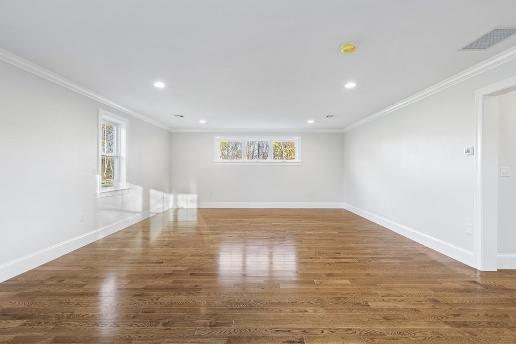430 High Street Walpole, MA 02081 - Photo 30 of 42 a view of empty room with wooden floor and fan