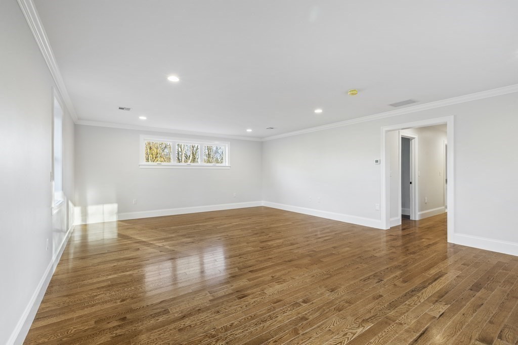 430 High Street Walpole, MA 02081 - Photo 31 of 42 a view of an empty room with wooden floor and a window