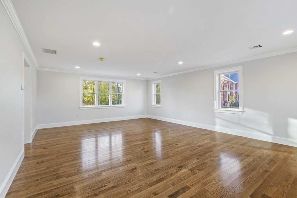 430 High Street Walpole, MA 02081 - Photo 32 of 42 a view of an empty room with wooden floor and a window