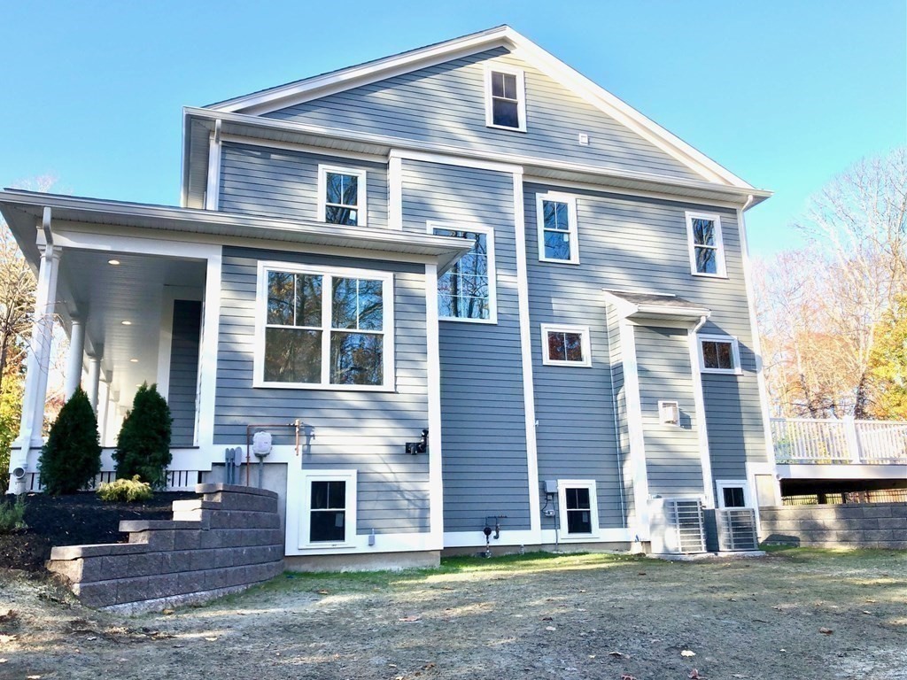 430 High Street Walpole, MA 02081 - Photo 34 of 42 a front view of a house with a yard