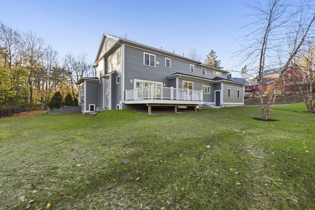 430 High Street Walpole, MA 02081 - Photo 35 of 42 a front view of a house with a yard and trees