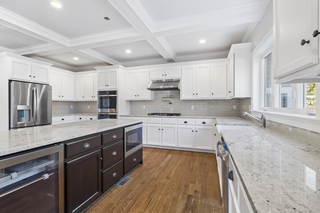 430 High Street Walpole, MA 02081 - Photo 8 of 42 a large kitchen with stainless steel appliances sink a stove and cabinets