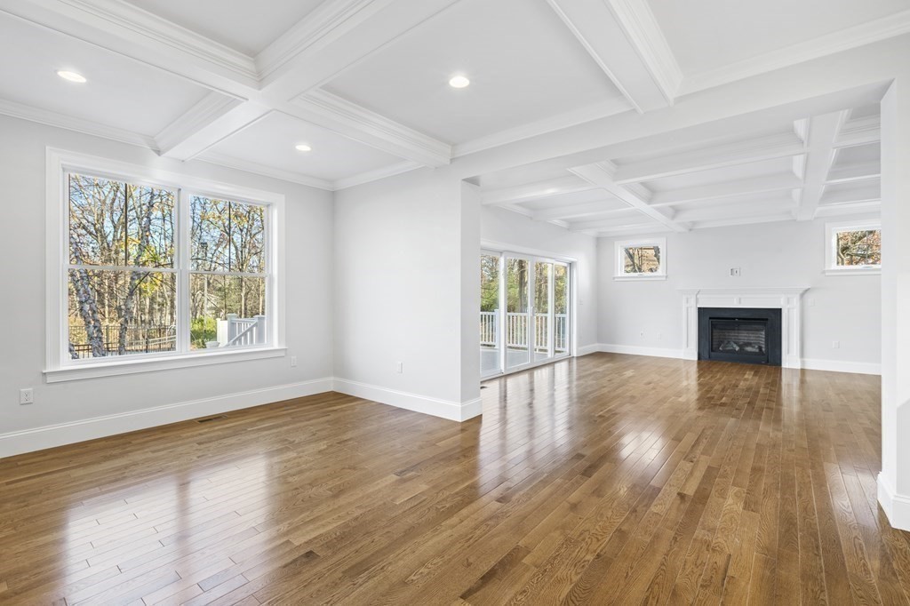 430 High Street Walpole, MA 02081 - Photo 10 of 42 a view of empty room with wooden floor and fireplace