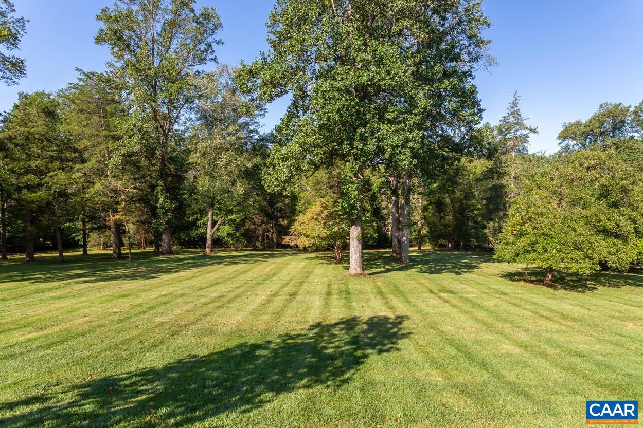 1340 Sunset Circle Charlottesville, VA 22901 - Photo 7 of 15 a swimming pool with trees in the background