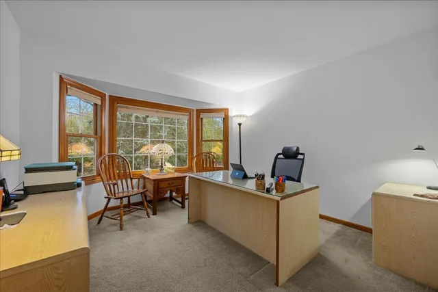 a living room with furniture cabinets and a flat screen tv