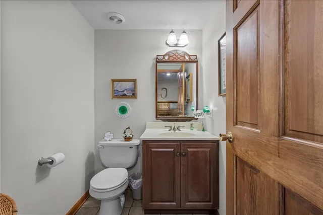 a room with furniture pool table and window