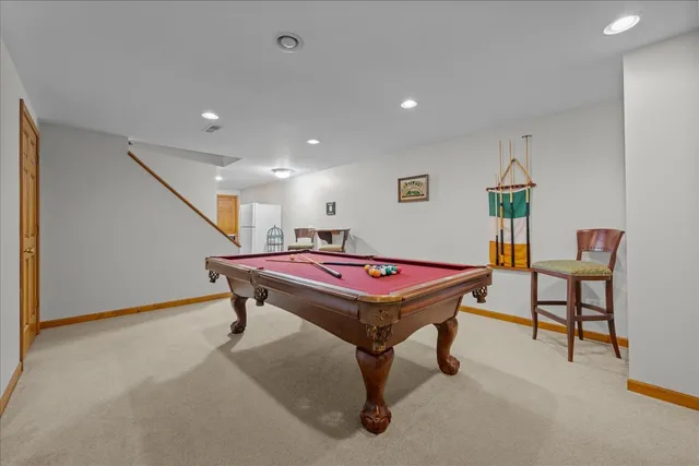 a swimming pool view with a seating space