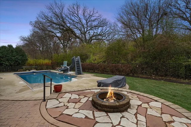 aerial view of a house with a yard and a fountain